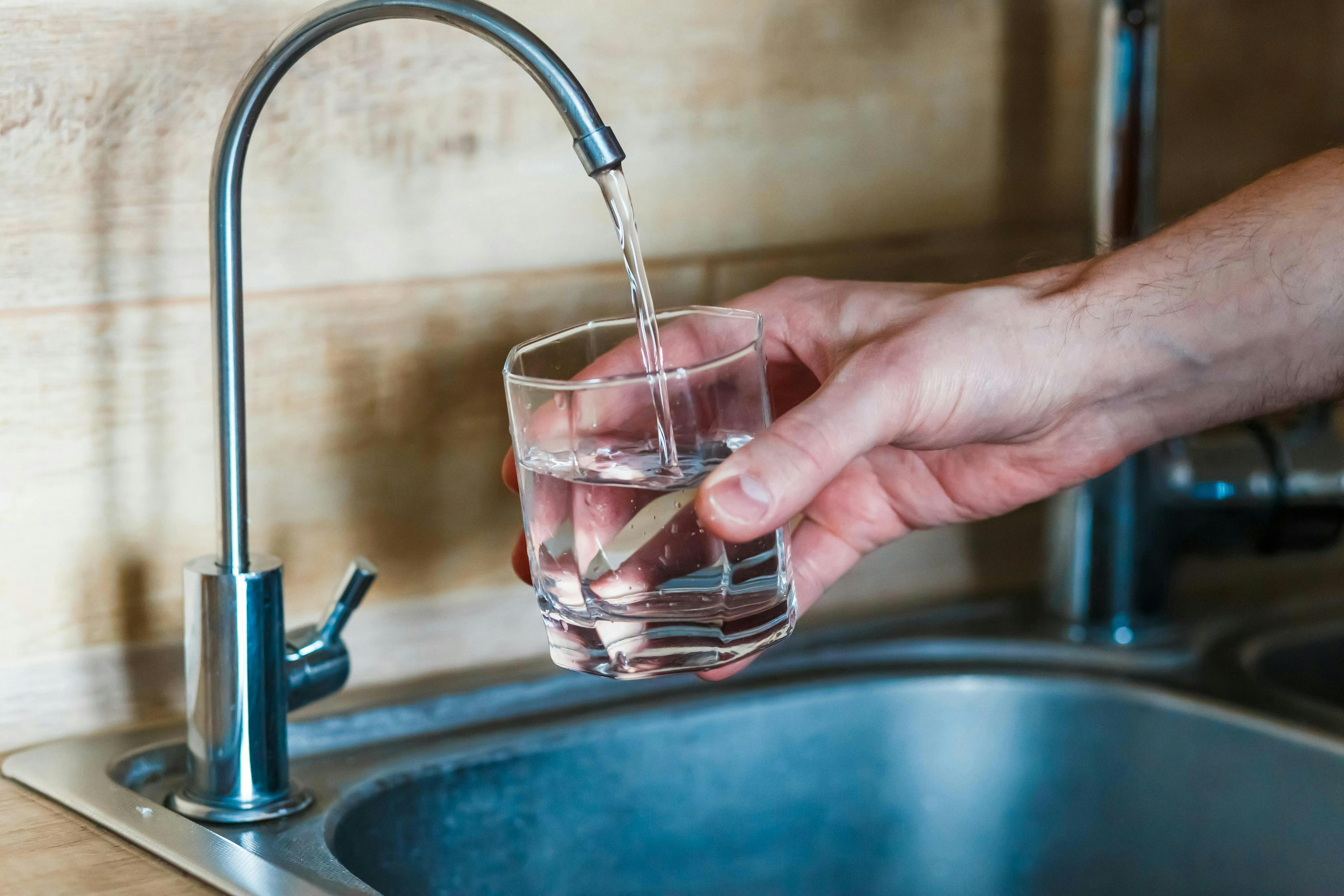 Water Quality Report  Hand Holds Fresh Water Glass