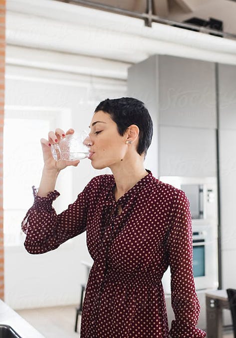 Woman Drinking Filtered Faucet Tap Water